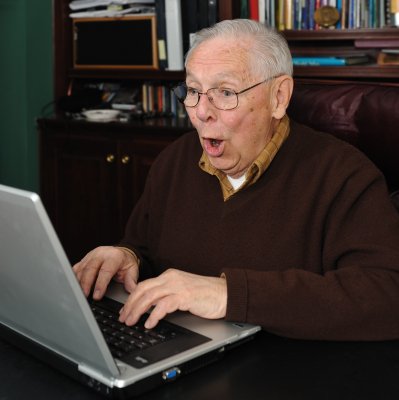 old man on laptop identity theft